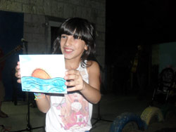 Leen Holding a peace postcard Open House Ramle