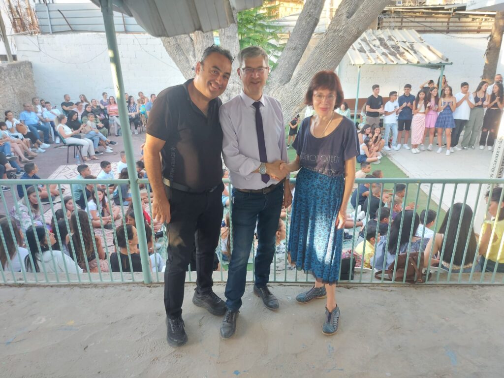 Mayor Michael Vidal visits summer camp farewell party. On his right and left are Khader Alkalak administrative manager of Open House and Dalia 